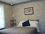 Lilac Room has a/c, ceiling fan, Queen size bed and private bathroom .