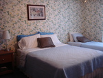 Our Rose room has a Queen and Single Bed , also has ensuite bathroom, a/c and ceilling fan