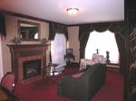 Master bedroom's sitting room with fireplace