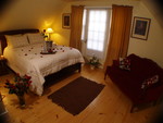 Upstairs Queen Size bedroom with sitting area.
