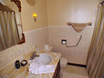 Main floor bathroom includes tub/shower combination and plenty of counter space. Hairdryer provided.