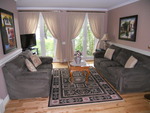 Living room features a view of the gardens, watch horse drawn carriages ride by!
