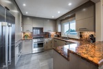Kitchen - Stainless steel appliances and quartz counter tops